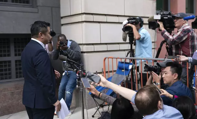 TikTok content creator Paul Tran talk to the press as he leaves the federal courthouse in Washington, Monday, Sept. 16, 2024, after a hearing on TikTok's lawsuit against the federal government. (AP Photo/Jose Luis Magana)