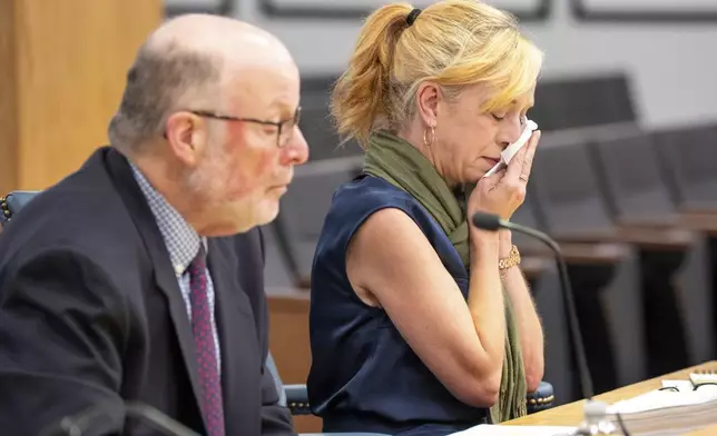 Amber Bay, Former OceanGate Director of Administration breaks down into tears while giving a final statement at the Titan marine board of investigation hearing inside the Charleston County Council Chambers Tuesday, Sept. 24, 2024, in North Charleston, S.C. (Corey Connor via AP, Pool)