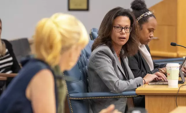 OceanGate's representative look on during Amber Bay, Former OceanGate Director of Administration's testimony at the Titan marine board of investigation hearing inside the Charleston County Council Chambers Tuesday, Sept. 24, 2024, in North Charleston, S.C. (Corey Connor via AP, Pool)