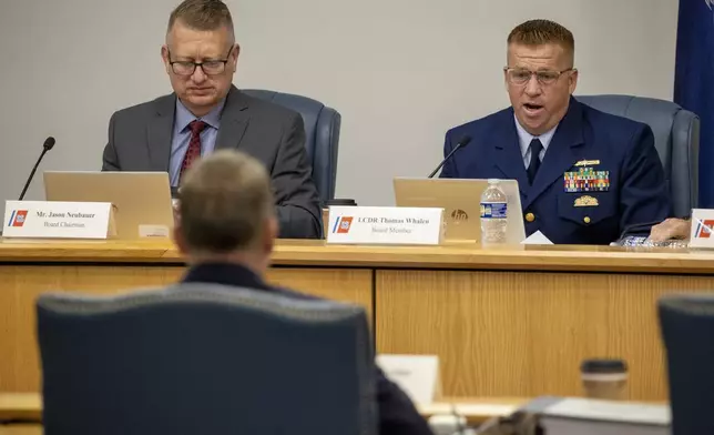 Board Chairman Jason Neubauer, left, and board member Thomas Whalen, of the investigative board for the Titan marine board formal hearing, speak with former OceanGate's Director of Marine Operations David Lochridge, foreground, Tuesday, Sept. 17, 2024, in North Charleston, S.C. (Andrew J. Whitaker/The Post And Courier via AP, Pool)