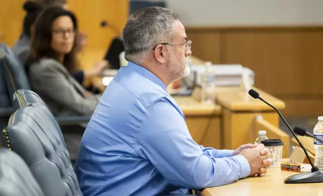 Matthew McCoy, a former OceanGate employee, listens to questions from the investigative board during the final day of the Coast Guard investigatory hearing on the causes of the implosion of an experimental submersible headed for the wreck of the Titanic, Friday, Sept. 27, 2024, in North Charleston, S.C. (AP Photo/Mic Smith)