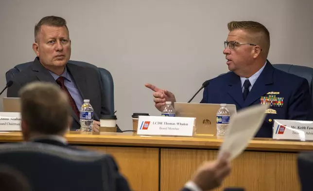 Board Chairman Jason Neubauer, left, and board member Thomas Whalen, of the investigative board for the Titan marine board formal hearing, speak with former OceanGate's Director of Marine Operations David Lochridge, foreground left, Tuesday, Sept. 17, 2024, in North Charleston, S.C. (Andrew J. Whitaker/The Post And Courier via AP, Pool)