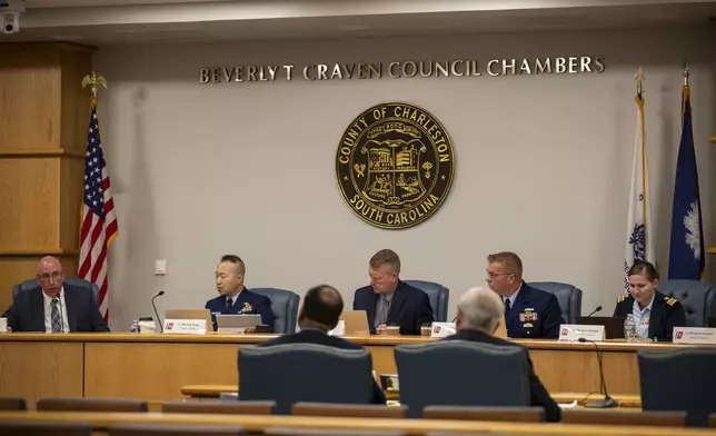 Members of the Coast Guard's Titan Submersible Marine Board of Investigation listen during the formal hearing inside the Charleston County Council Chambers, Monday, Sept. 23, 2024, in North Charleston, S.C. (Laura Bilson/The Post And Courier via AP, Pool)