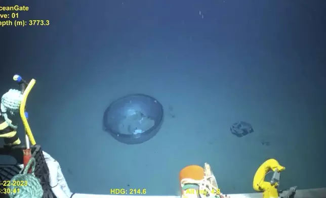 This June 2023 United States Coast Guard still frame from video provided by Pelagic Research Services, shows remains of the Titan submersible, center, on the floor of the Atlantic Ocean. (U.S. Coast Guard Video courtesy Pelagic Research Services via AP)