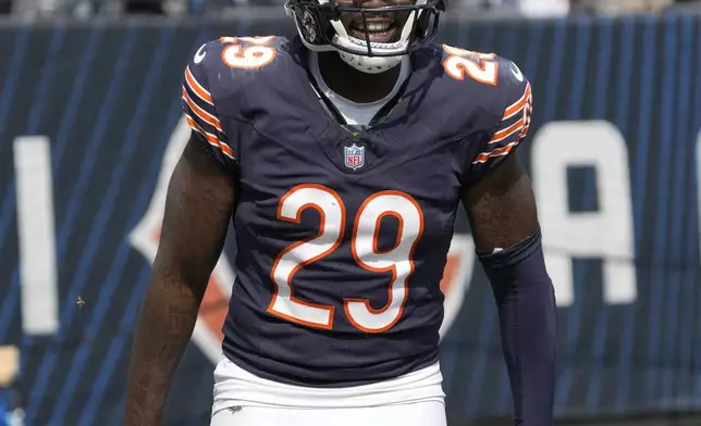 Chicago Bears cornerback Tyrique Stevenson smiles as he walks back to the bench after his touchdown off a pass attempt by Tennessee Titans quarterback Will Levis during the second half of an NFL football game Sunday, Sept. 8, 2024, in Chicago. (AP Photo/Nam Y. Huh)