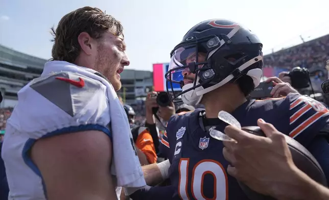 Tennessee Titans quarterback Will Levis and Chicago Bears quarterback Caleb Williams talk after the Bears' 24-17 win over the Titans in an NFL football game Sunday, Sept. 8, 2024, in Chicago. (AP Photo/Erin Hooley)