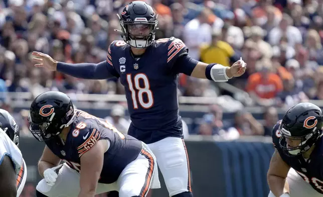 Chicago Bears quarterback Caleb Williams calls a play at the line of scrimmage during the first half of an NFL football game against the Tennessee Titans on Sunday, Sept. 8, 2024, in Chicago. (AP Photo/Nam Y. Huh)