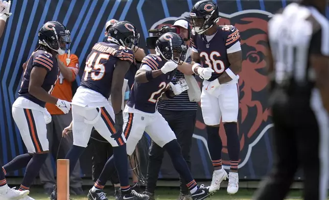 Chicago Bears' Jonathan Owens (36) celebrates with teammates after scoring on a blocked Tennessee Titans' punt during the second half of an NFL football game Sunday, Sept. 8, 2024, in Chicago. (AP Photo/Erin Hooley)