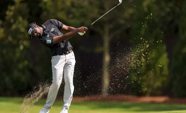 Sahith Theegala hits his second shot from the fairway on the seventh hole during the third round of the Tour Championship golf tournament, Saturday, Aug. 31, 2024, in Atlanta. (AP Photo/Jason Allen)