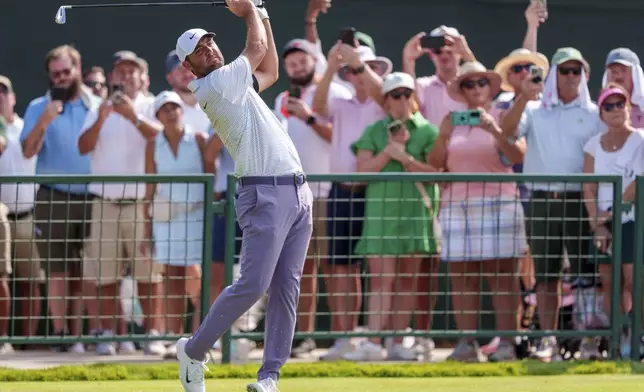 Scottie Scheffler hits his drive from the eighth tee during the third round of the Tour Championship golf tournament, Saturday, Aug. 31, 2024, in Atlanta. (AP Photo/Jason Allen)