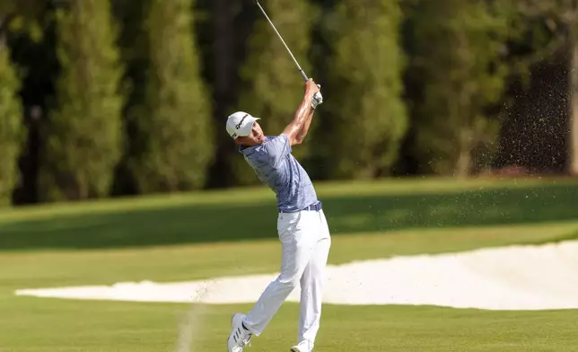 Collin Morikawa hits his second shot from the fairway on the seventh hole during the third round of the Tour Championship golf tournament, Saturday, Aug. 31, 2024, in Atlanta. (AP Photo/Jason Allen)