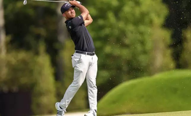 Xander Schauffele hits his second shot from the fairway on the seventh hole during the third round of the Tour Championship golf tournament, Saturday, Aug. 31, 2024, in Atlanta. (AP Photo/Jason Allen)