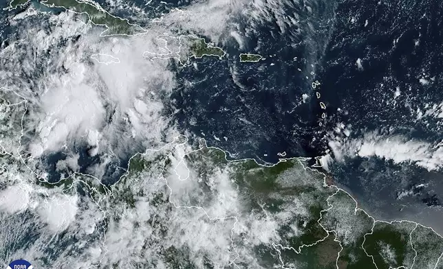 This image provided by the National Oceanic and Atmospheric Administration shows a cluster of storms located south of the Cayman Islands which are expected to strengthen in upcoming days, Monday, Sept. 23, 2024. (NOAA via AP)