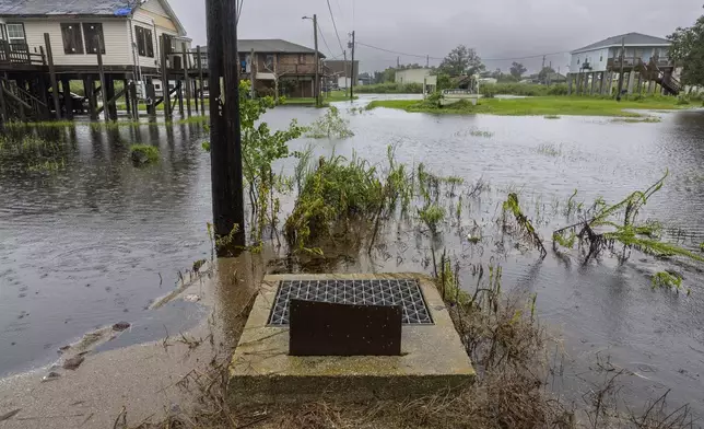 Rising water has no where to go around a drainage opening, center, in Dulac as the effects of Hurricane Francine are felt along the Louisiana coast on Wednesday, Sept.11, 2024. (Chris Granger/The Times-Picayune/The New Orleans Advocate via AP)