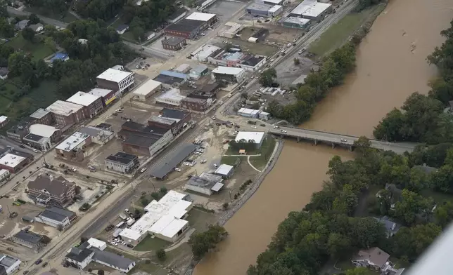 An aerial view of flood damage along the Pigeon River left by Hurricane Helene, Saturday, Sept. 28, 2024, in Newport, Tenn. (AP Photo/George Walker IV)