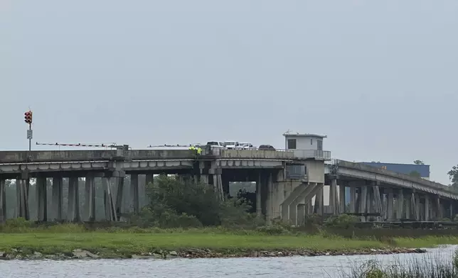 Harrison County officials workon Bayou Portage bridge in Pass Christian, Miss. in preparation of Hurricane Francine Wednesday, Sept. 11, 2024. (Hunter Dawkins/The Gazebo Gazette via AP)