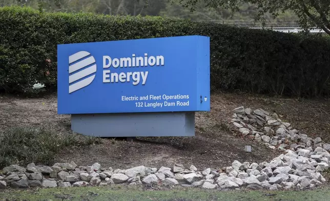 The Dominion Energy sign outside of the Electric and Fleet Operations center in the aftermath of Hurricane Helene Sunday, Sept. 29, 2024, in Aiken, S.C. (AP Photo/Artie Walker Jr.)