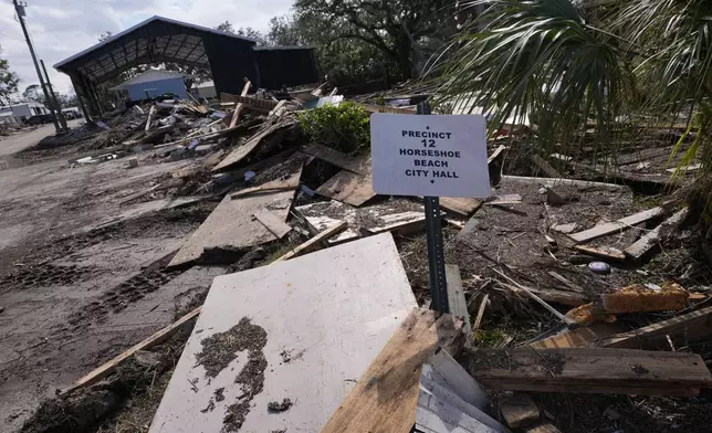 The ruins of city hall are seen in the aftermath of Hurricane Helene, in Horseshoe Beach, Fla., Saturday, Sept. 28, 2024. (AP Photo/Gerald Herbert)