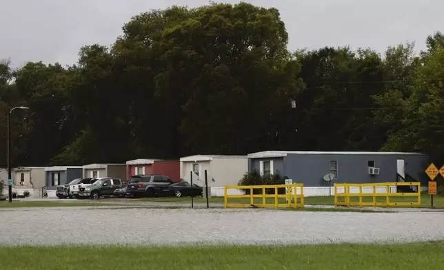 Arrowood Mobile Home Park in Steele Creek is flooded after Hurricane Helen passed the area Friday, Sept. 27, 2024 in Charlotte, N.C. (Melissa Melvin-Rodriguez/The Charlotte Observer via AP)