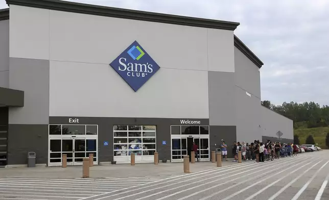 Residents wait in line at Sam's Club in the aftermath of Hurricane Helene Sunday, Sept. 29, 2024, in Aiken, S.C. (AP Photo/Artie Walker Jr.)