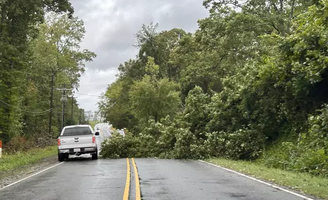 Downed tree blocks Mt. Holly Rd, after Hurricane Helen passed the area Friday, Sept. 27, 2024 in Charlotte, N.C. (Melissa Melvin-Rodriguez/The Charlotte Observer via AP)