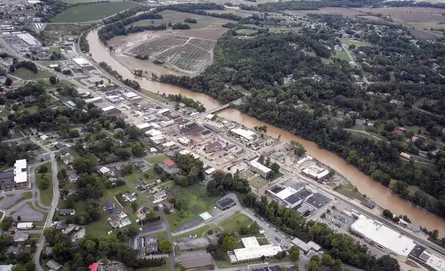 An aerial view of flood damage along the Pigeon River left by Hurricane Helene, Saturday, Sept. 28, 2024, in Newport, Tenn. (AP Photo/George Walker IV)