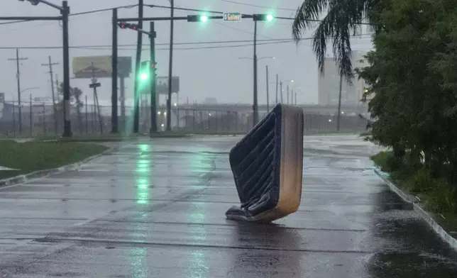 An air mattress blows in wind from Hurricane Francine in New Orleans, Wednesday, Sept. 11, 2024. (AP Photo/Matthew Hinton)