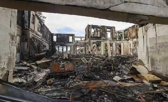 The remains of a home on Davis Island that burned during Hurricane Helene on Saturday, Sept. 28, 2024, in Tampa, Fla. (AP Photo/Mike Carlson)