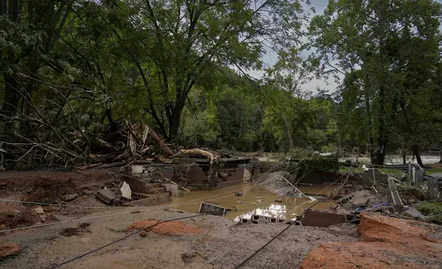 A home site destroyed by flood water is seen Saturday, Sept. 28, 2024, in Newport, Tenn. (AP Photo/George Walker IV)