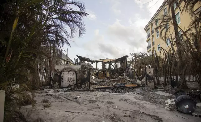 A home completely destroyed by fire due to Hurricane Helene is pictured on Saturday, Sept. 28, 2024, in Madeira Beach, Fla. (Luis Santana/Tampa Bay Times via AP)