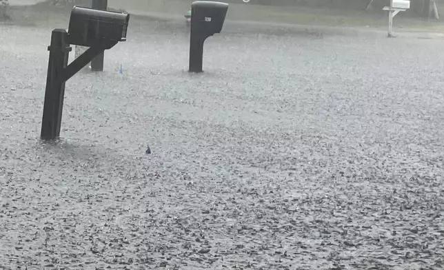 Roads flood in heavy rains Monday, Sept. 16, 2024, in Southport, N.C. (Renee Spencer/The Star-News via AP)