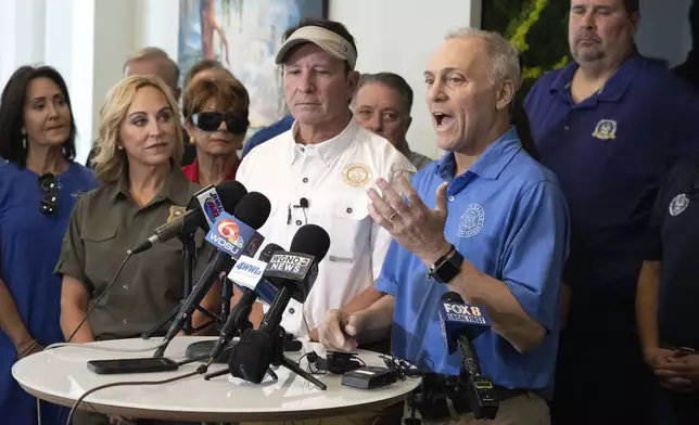 Louisiana Gov. Jeff Landry, center left, stands alongside U.S. Rep. Steve Scalise, center right, as he speaks about the impacts of Hurricane Francine, Friday, Sept. 13, 2024, at New Orleans International Airport in Kenner, La. (Hilary Scheinuk/The Advocate via AP, Pool)