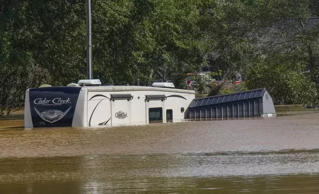 The Riverside RV park was flooded from the overflowing Catawba River after torrential rain from Hurricane Helene, Saturday, Sept. 28, 2024, in Morganton, N.C. (AP Photo/Kathy Kmonicek)