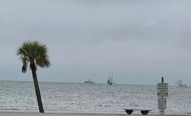 Boats leaving Pass Christian Harbor after mandatory evacuation issued Tuesday, Sept. 10, 2024, in Pass Christian, Miss., due to Tropical Storm Francine. (Hunter Dawkins/The Gazebo Gazette via AP)