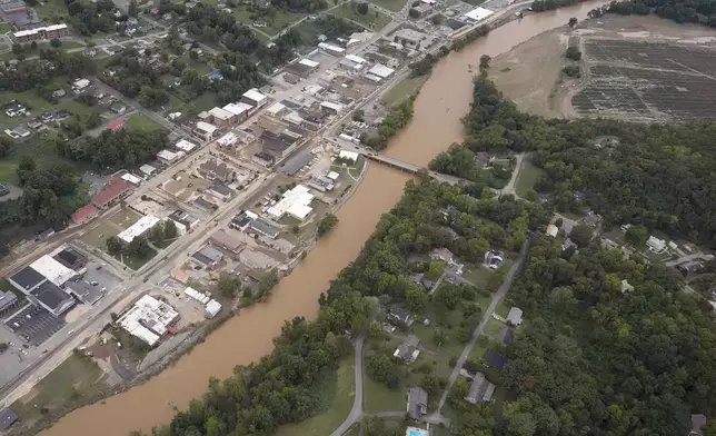 An aerial view of flood damage along the Pigeon River left by Hurricane Helene, Saturday, Sept. 28, 2024, in Newport, Tenn. (AP Photo/George Walker IV)