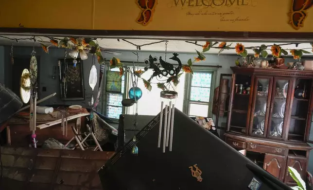 Flood damage is seen inside a home along River Rd., Saturday, Sept. 28, 2024, in Newport, Tenn. (AP Photo/George Walker IV)