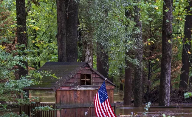 Floodwaters surround a structure Friday, Sept 27, 2024, in Atlanta. (AP Photo/Jason Allen)