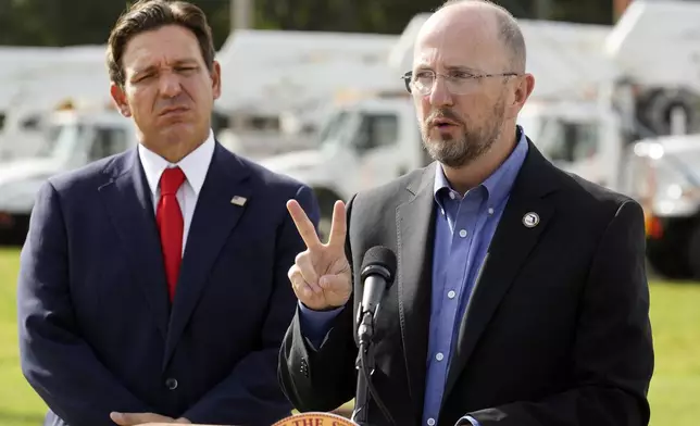 Kevin Guthrie, Director of Florida Division of Emergency Management, right, gestures as Gov. Ron DeSantis looks on during a news conference, Wednesday, Sept. 25, 2024, at the Tampa Electric Company offices in Tampa, Fla., as Tropical Storm Helene, expected to become a hurricane, moves north along Mexico’s coast toward the U.S. (AP Photo/Chris O'Meara)