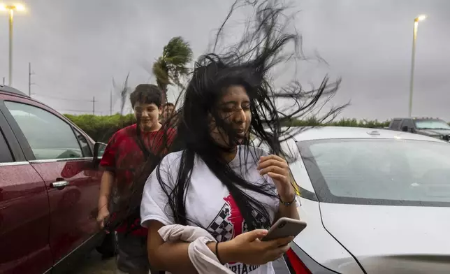 Melanie Galindo's hair flies in the swirl of fast-moving air as the eye wall of Hurricane Francine crosses into the Houma area in Louisiana on Wednesday, September 11, 2024. (Chris Granger, The Times-Picayune via AP)