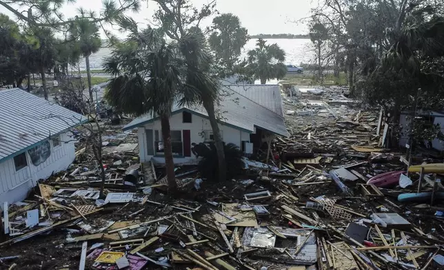 Destruction to the Faraway Inn Cottages and Motel is seen in the aftermath of Hurricane Helene, in Cedar Key, Fla., Friday, Sept. 27, 2024. (AP Photo/Stephen Smith)