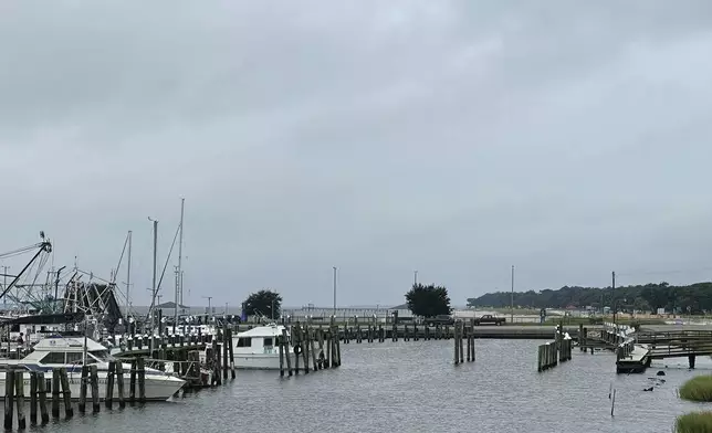 Boats leaving Pass Christian Harbor after mandatory evacuation issued Tuesday, Sept. 10, 2024 in Pass Christian, Miss. due to Tropical Storm Francine. (Hunter Dawkins/The Gazebo Gazette via AP)