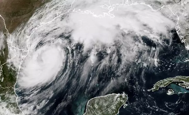 This GOES-16 GeoColor satellite image taken at 2:21 p.m. EDT and provided by National Oceanic and Atmospheric Administration (NOAA) shows Tropical Storm Francine in the Gulf of Mexico, Tuesday, Sept. 10 2024. (NOAA via AP)