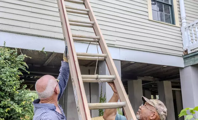 The windows of a raised historic house are boarded up as residents prepare for the arrival of Hurricane Francine along the Louisiana coast on Monday, Sept. 9, 2024, in Lafitte, La. (Chris Granger/The Times-Picayune/The New Orleans Advocate via AP)