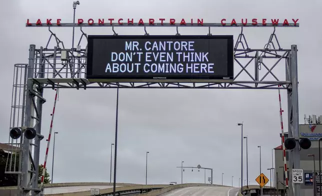 A message aimed at The Weather Channel's meteorologist Jim Cantore is displayed on the message board at the Lake Pontchartrain Causeway near New Orleans as the region prepares for Tropical Storm Francine Tuesday, Sept. 10, 2024. (David Grunfeld/The Times-Picayune/The New Orleans Advocate via AP)