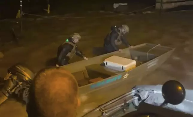 Lee County Sheriff's deputies dispatch a rescue boat to search for people trapped by floodwaters by Hurricane Helene in Fort Myers Beach, Fla., on Thursday, Sept. 26, 2024. (Lee County Sheriff's Office via AP)