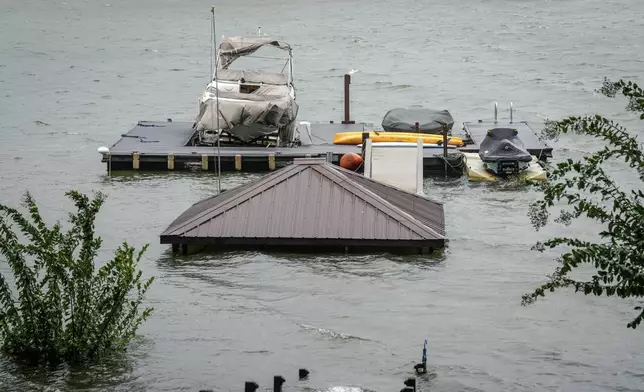 A gazebo and the stairs that lead to it are flooded and under water after Hurricane Helene passed the area on Lake James, Friday, Sept. 27, 2024 in Morganton, N.C. (AP Photo/Kathy Kmonicek)