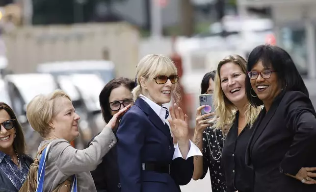 E. Jean Carroll greets people as she exits the New York Federal Court, after former President Donald Trump made an appearance, Friday, Sept. 6, 2024, in New York. (AP Photo/Eduardo Munoz Alvarez)