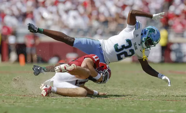 Tulane safety Bailey Despanie (32) hits Oklahoma quarterback Jackson Arnold late and gets called for unnecessary roughness during the second quarter of an NCAA college football game, Saturday, Sept. 14, 2024, in Norman, Okla. (AP Photo/Alonzo Adams)