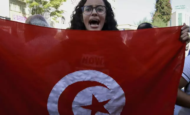 A Tunisian woman shouts slogans during a demonstration against Tunisia president Kais Saied, ahead of the upcoming presidential elections, in Tunis, Friday, Sept. 27, 2024. (AP Photo/Anis Mili)