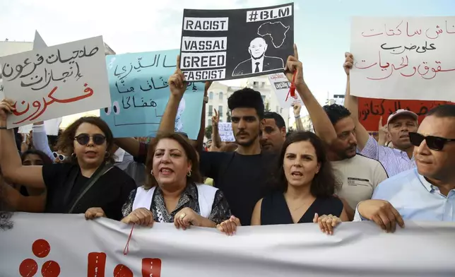 Tunisian take part in a protest against President Kais Saied ahead of the upcoming presidential elections, Friday, Sept. 13, 2024, on Avenue Habib Bourguiba in the capital Tunis. (AP Photo/Anis Mili)